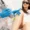 Woman receiving laser hair removal treatment on her legs by a professional wearing blue gloves in Cypress, TX